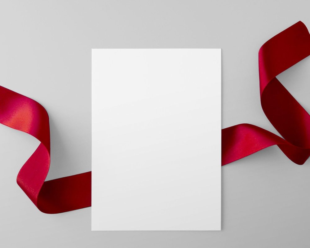 Paper Sheet with Red Ribbon